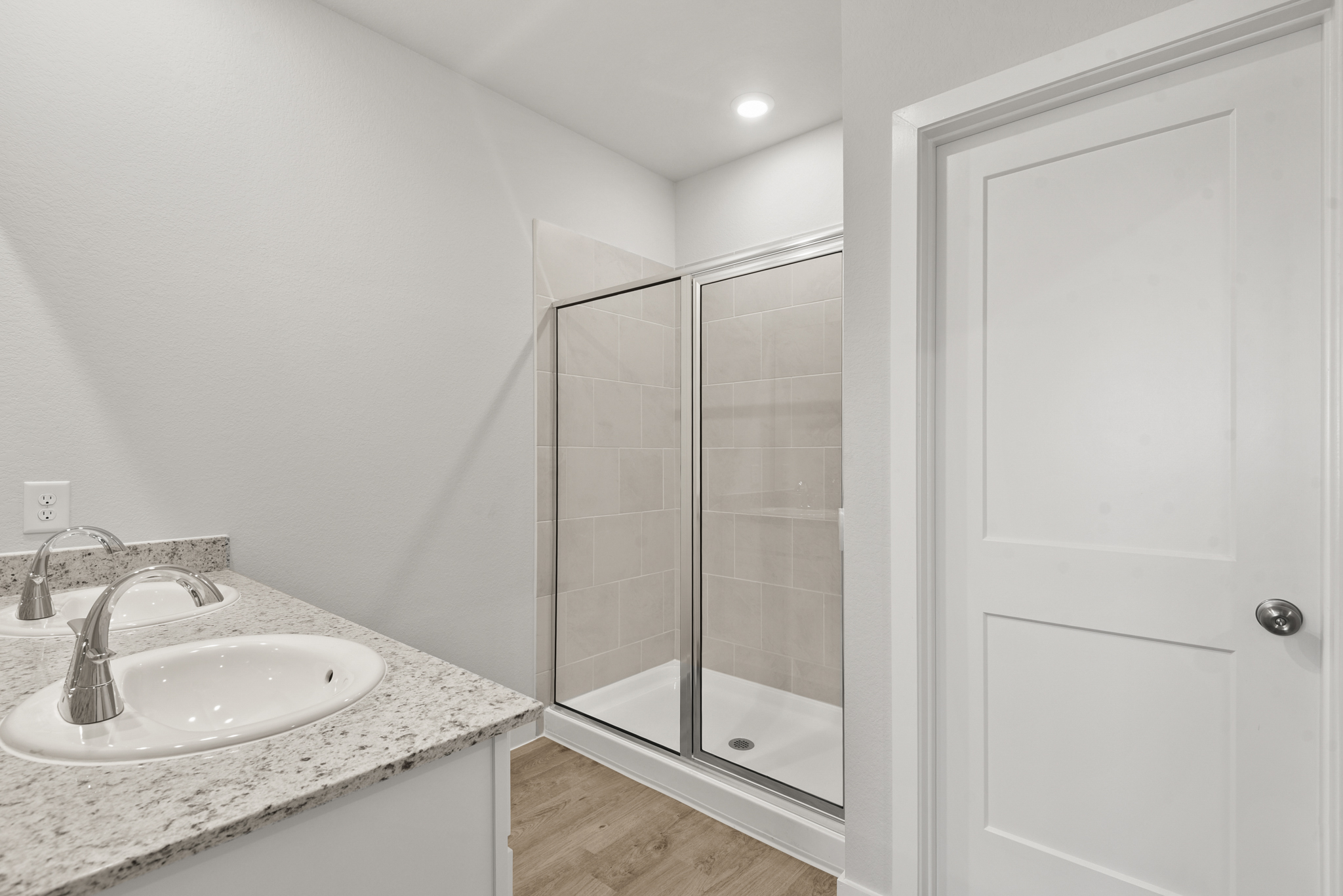 A bathroom with a glass shower.