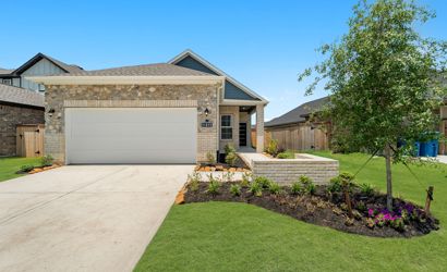 A house with a garage and a driveway.