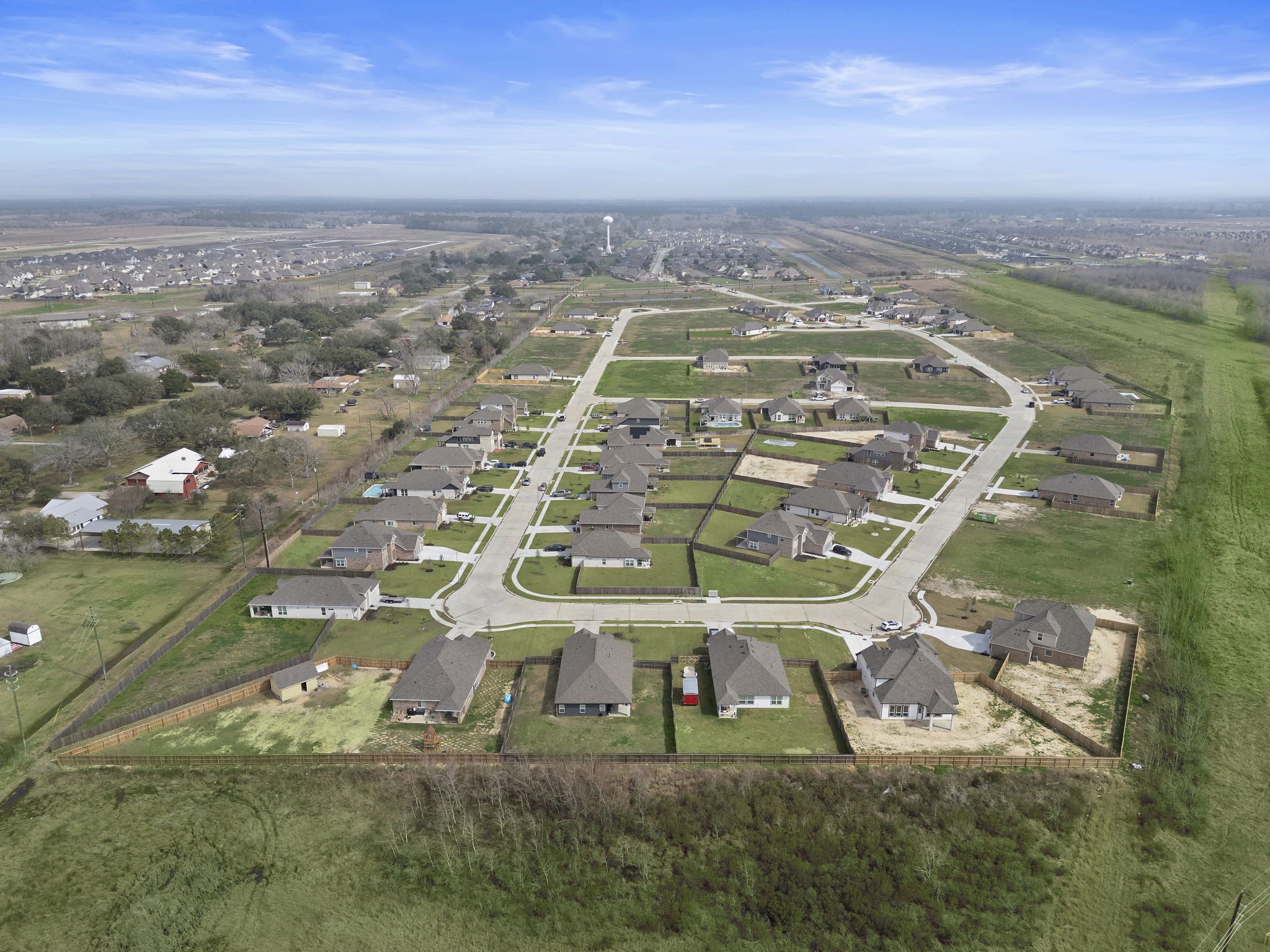 A landscape with houses and trees.