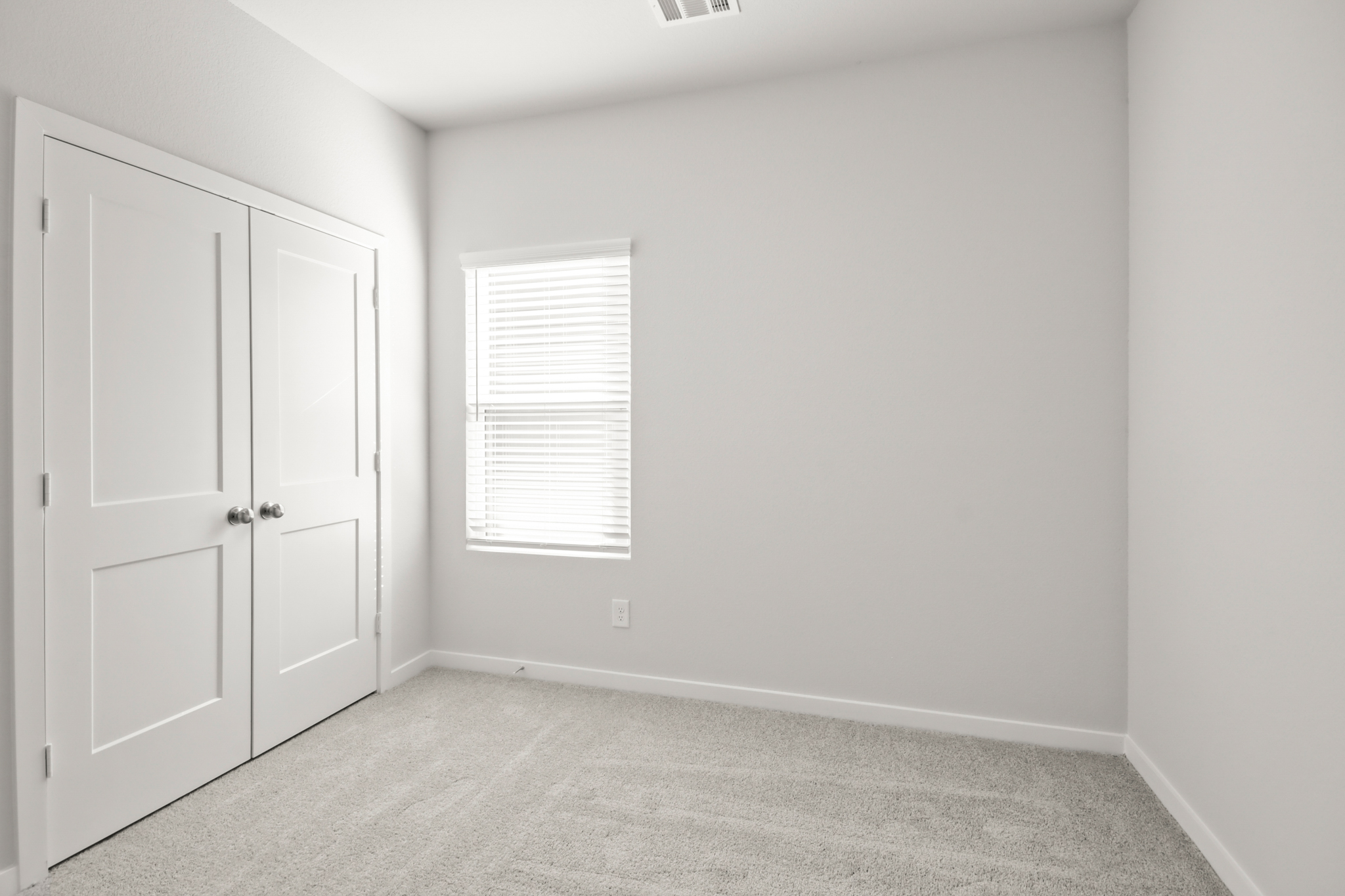 A room with white doors.