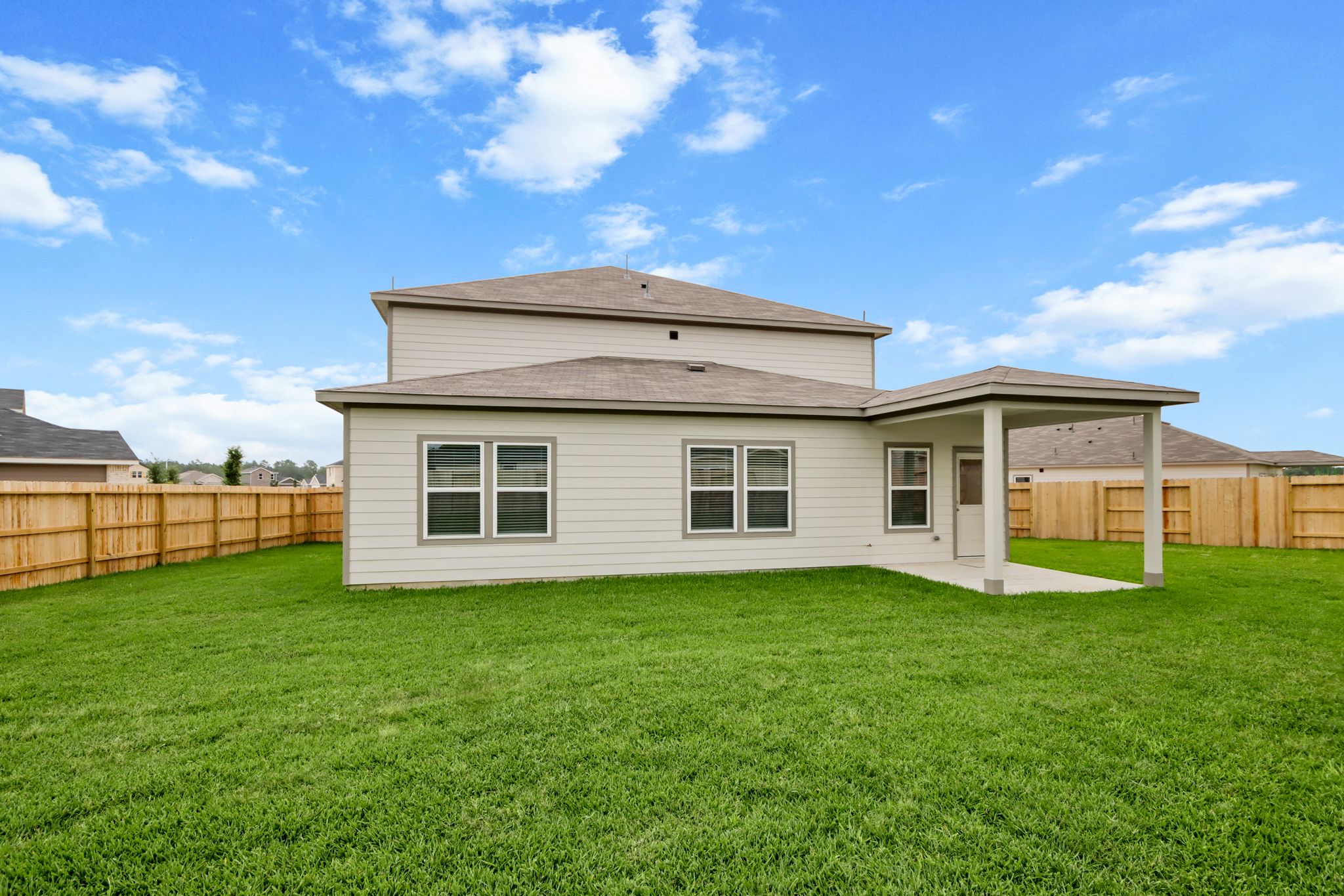 A house with a grass yard.