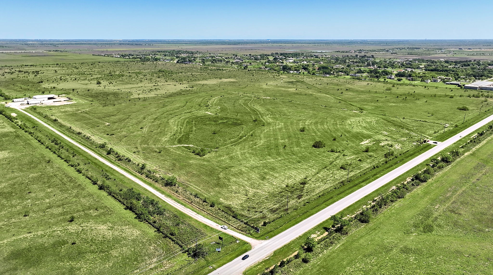 A road going through a field.