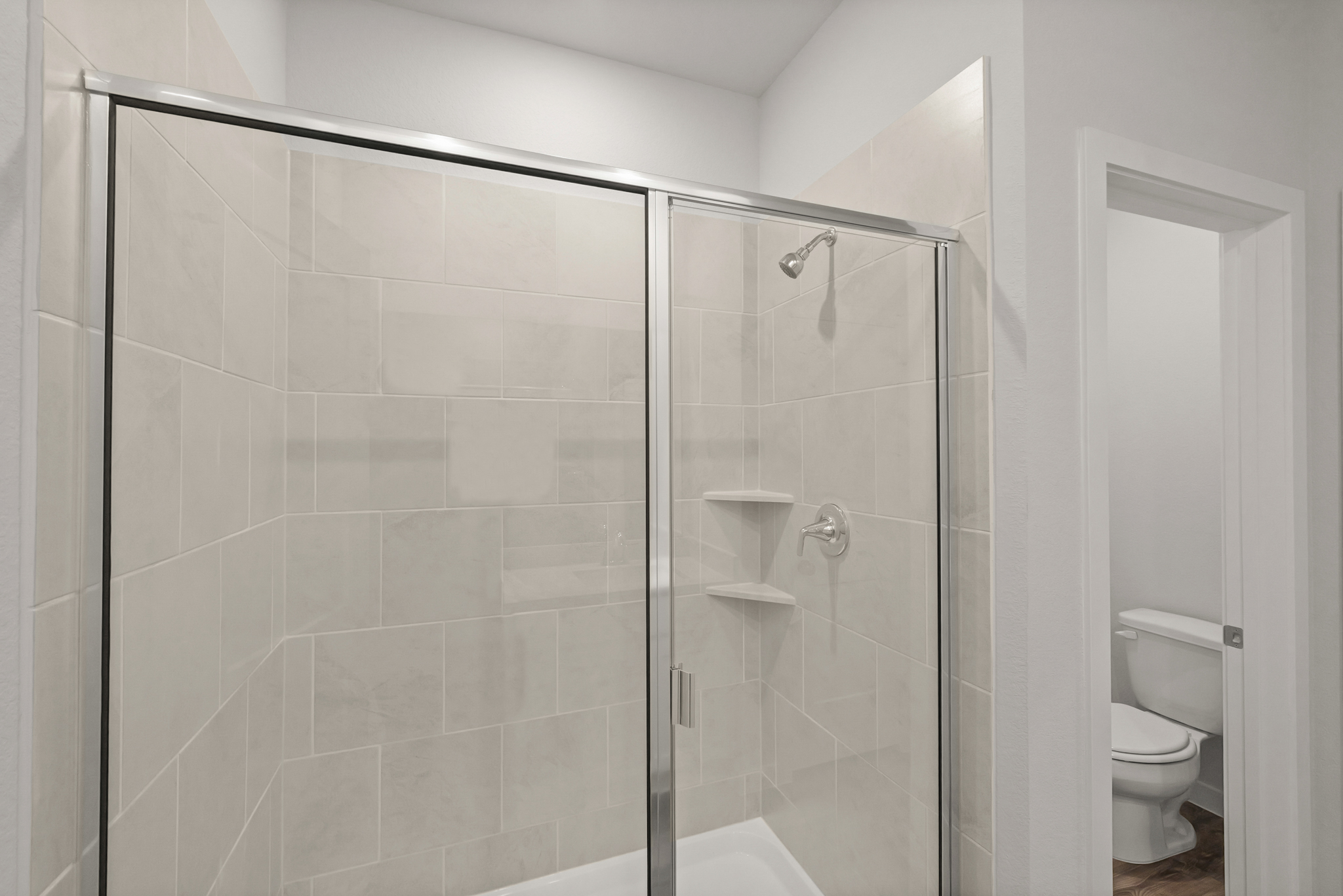 A bathroom with a glass shower.