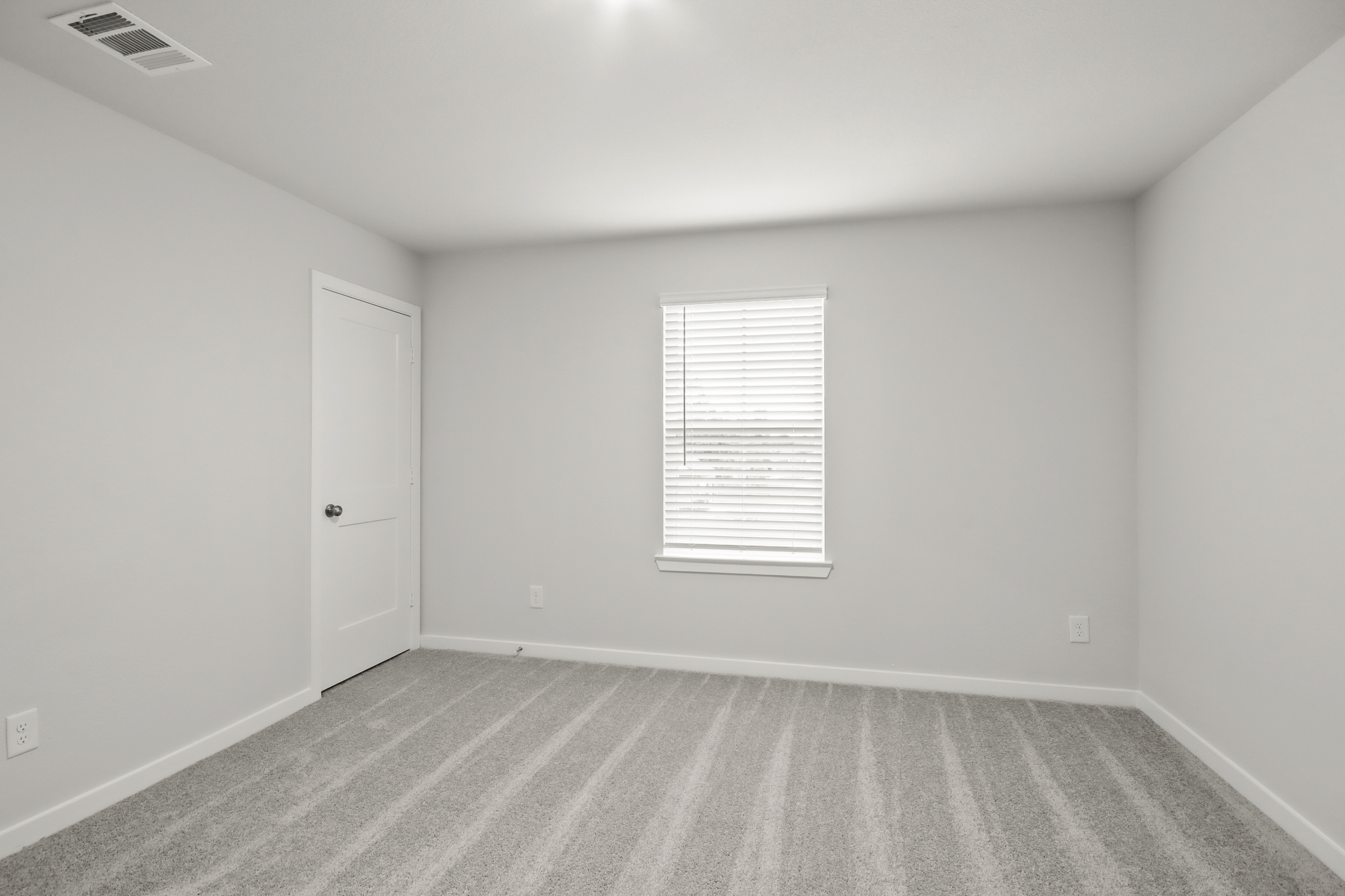 A room with a door and a window.