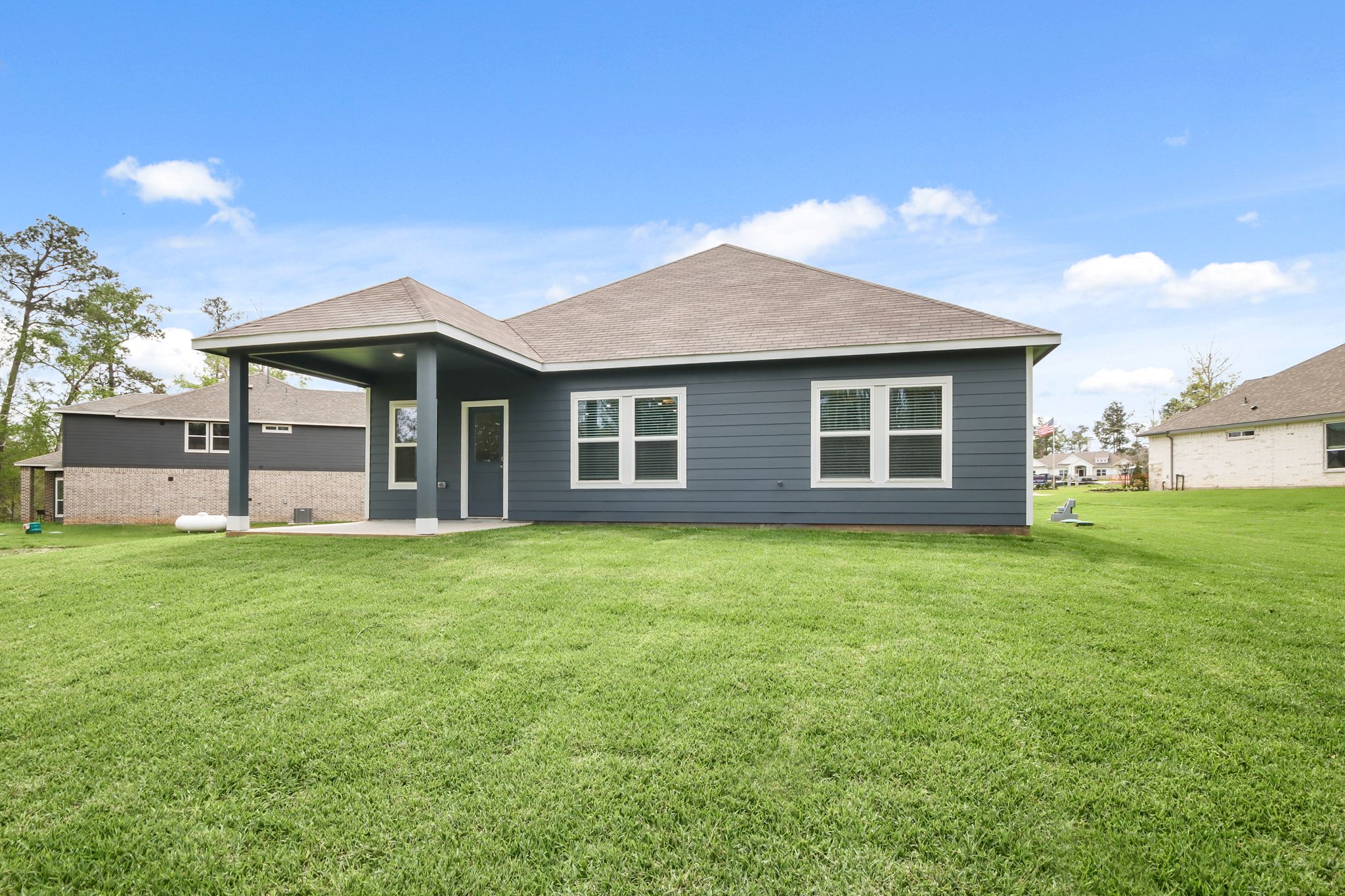 A house with a grass yard.