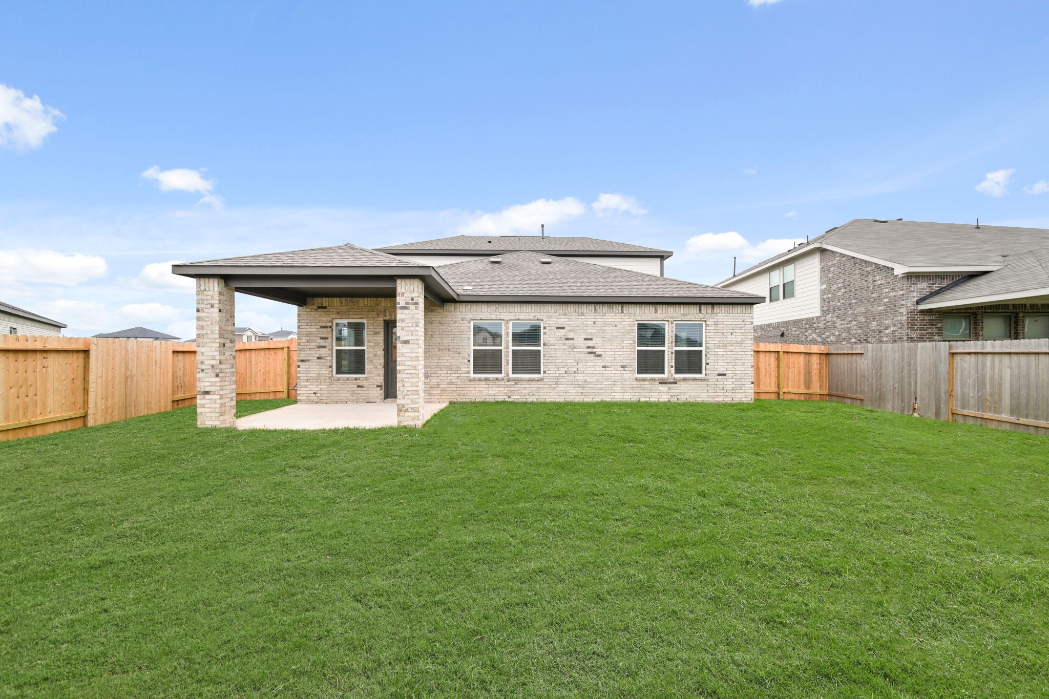 A house with a fence around it.