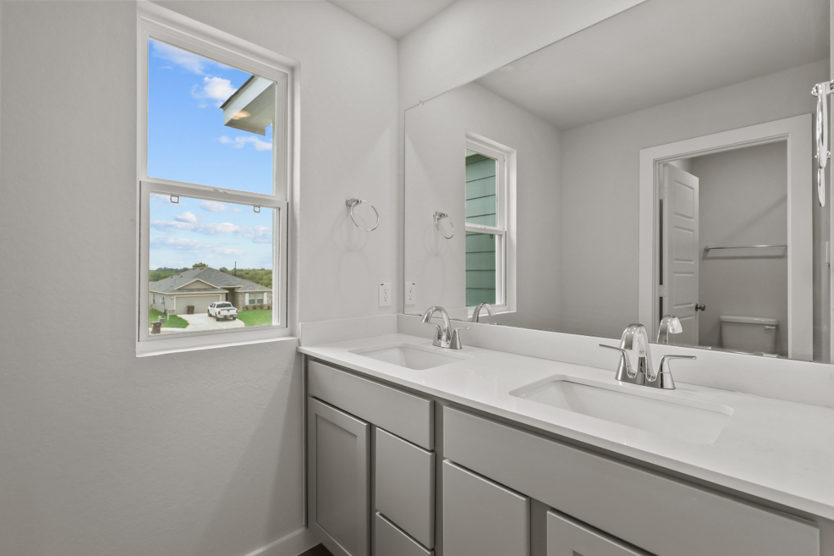 A bathroom with a large window.