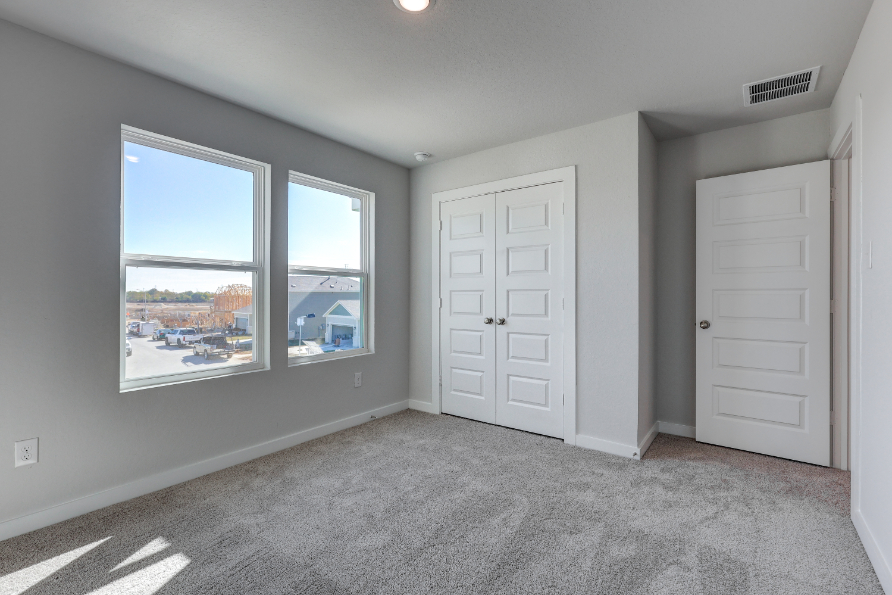 A room with white doors and windows.
