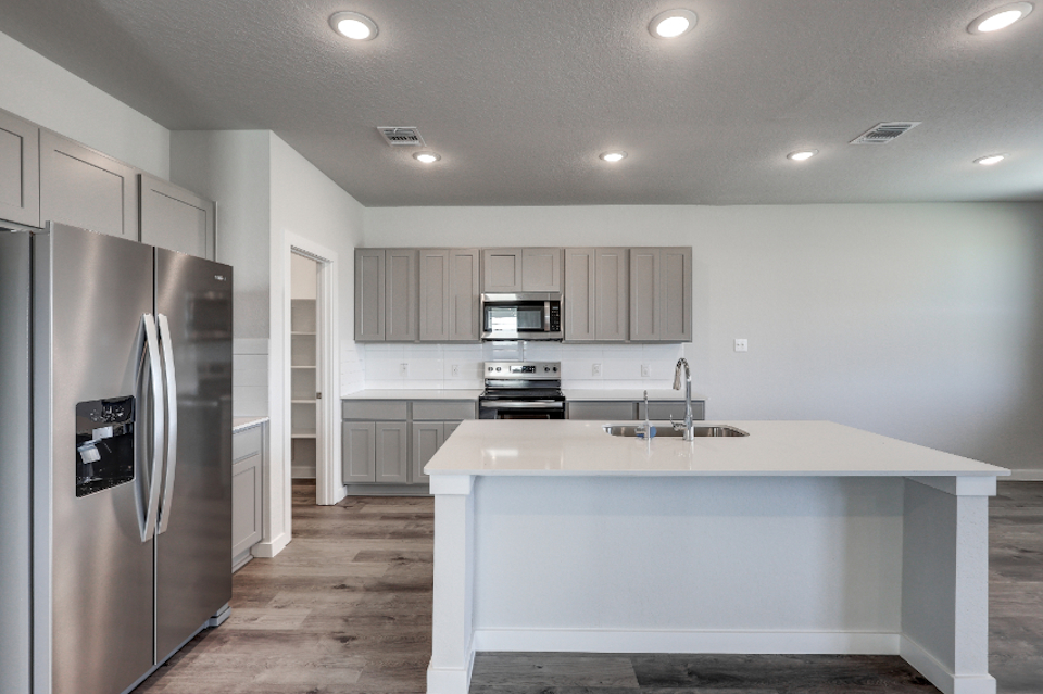 A kitchen with stainless steel appliances.
