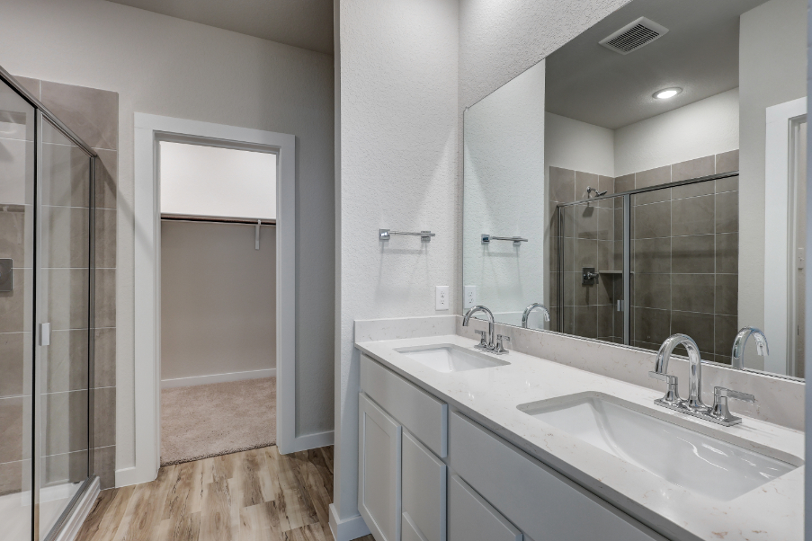 A bathroom with a glass shower.
