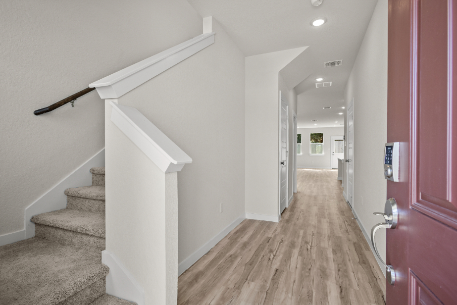 A hallway with white walls.