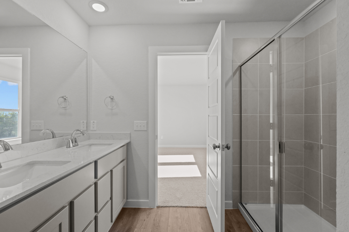 A bathroom with a glass shower.