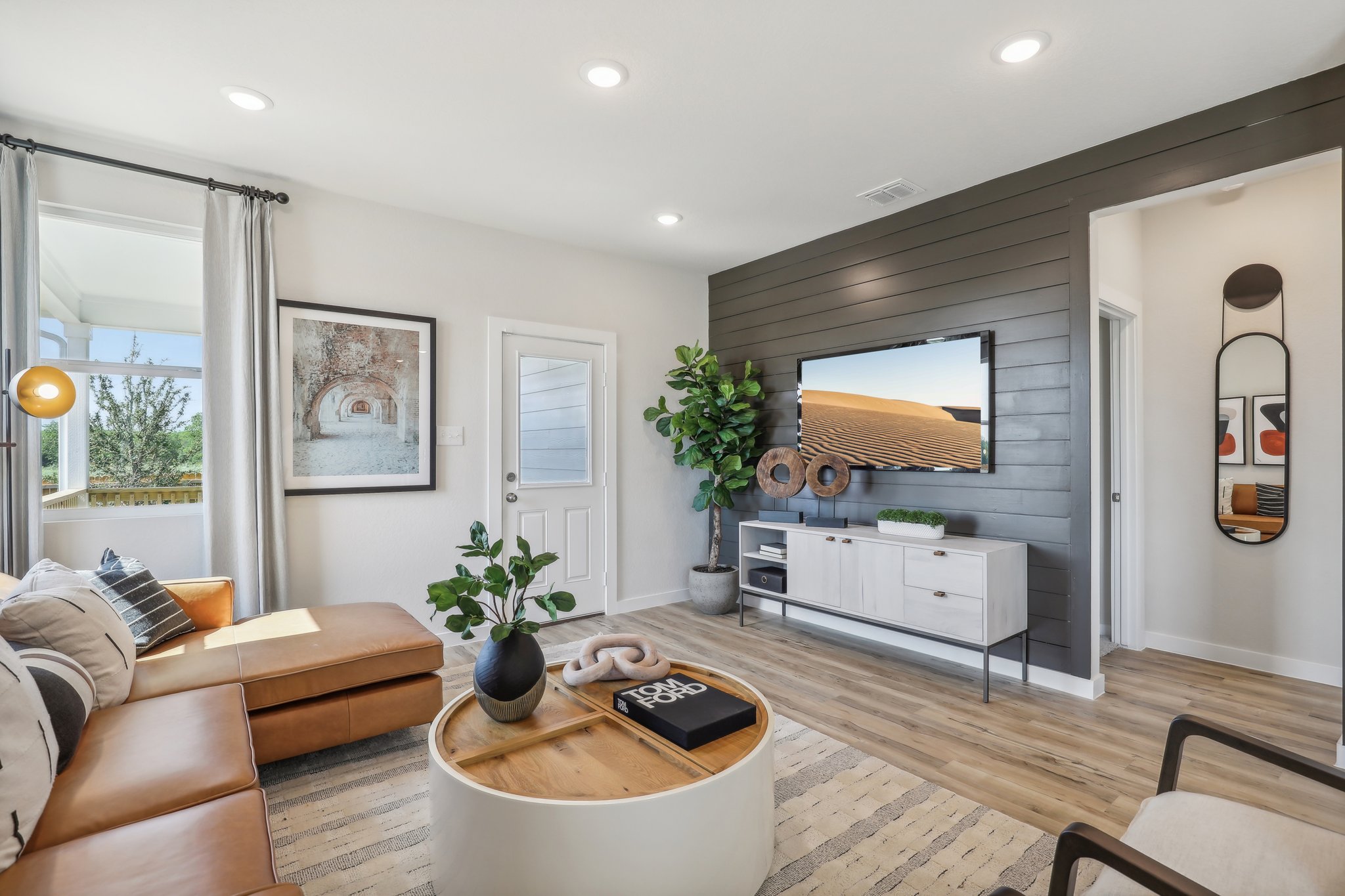 A living room with a large tv.