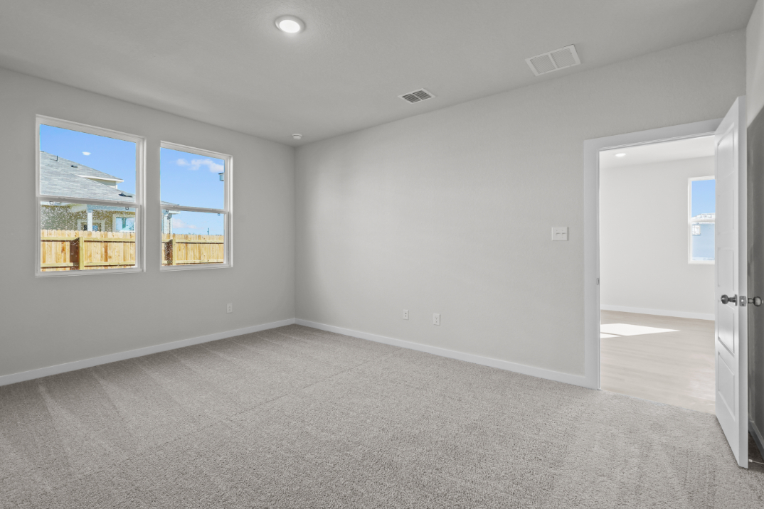 A room with a door and windows.