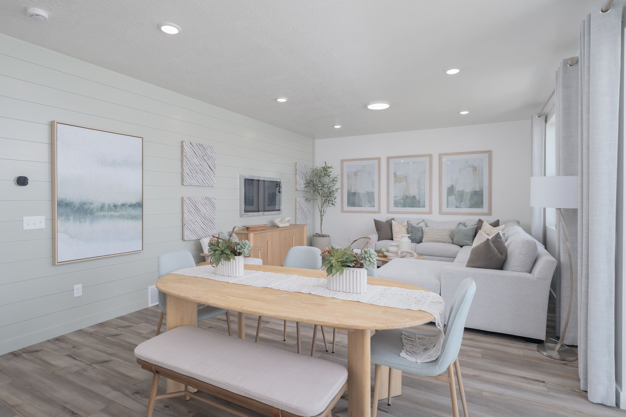 A living room with a couch and a table.