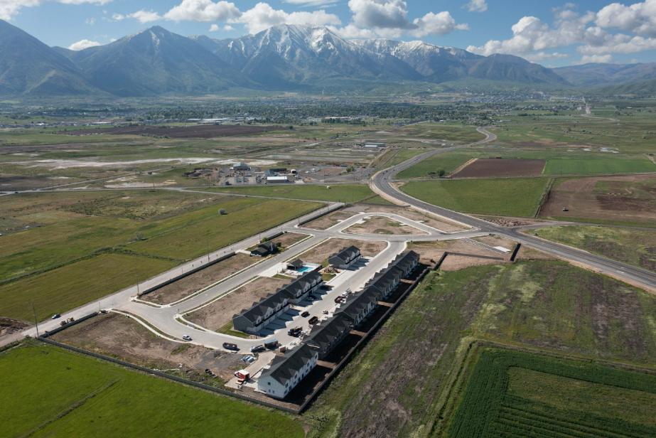 A large building with a parking lot.