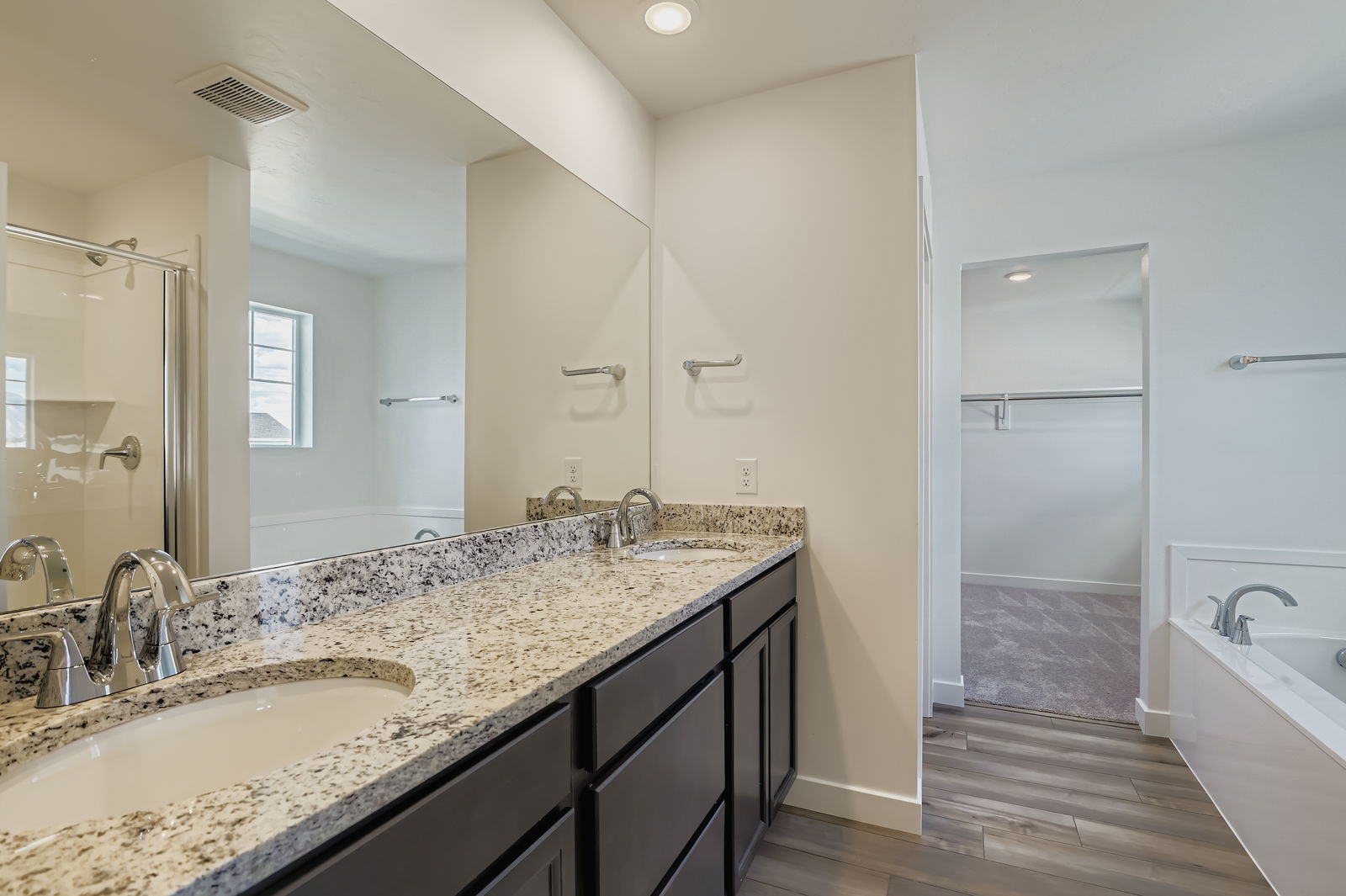 A bathroom with a marble countertop.
