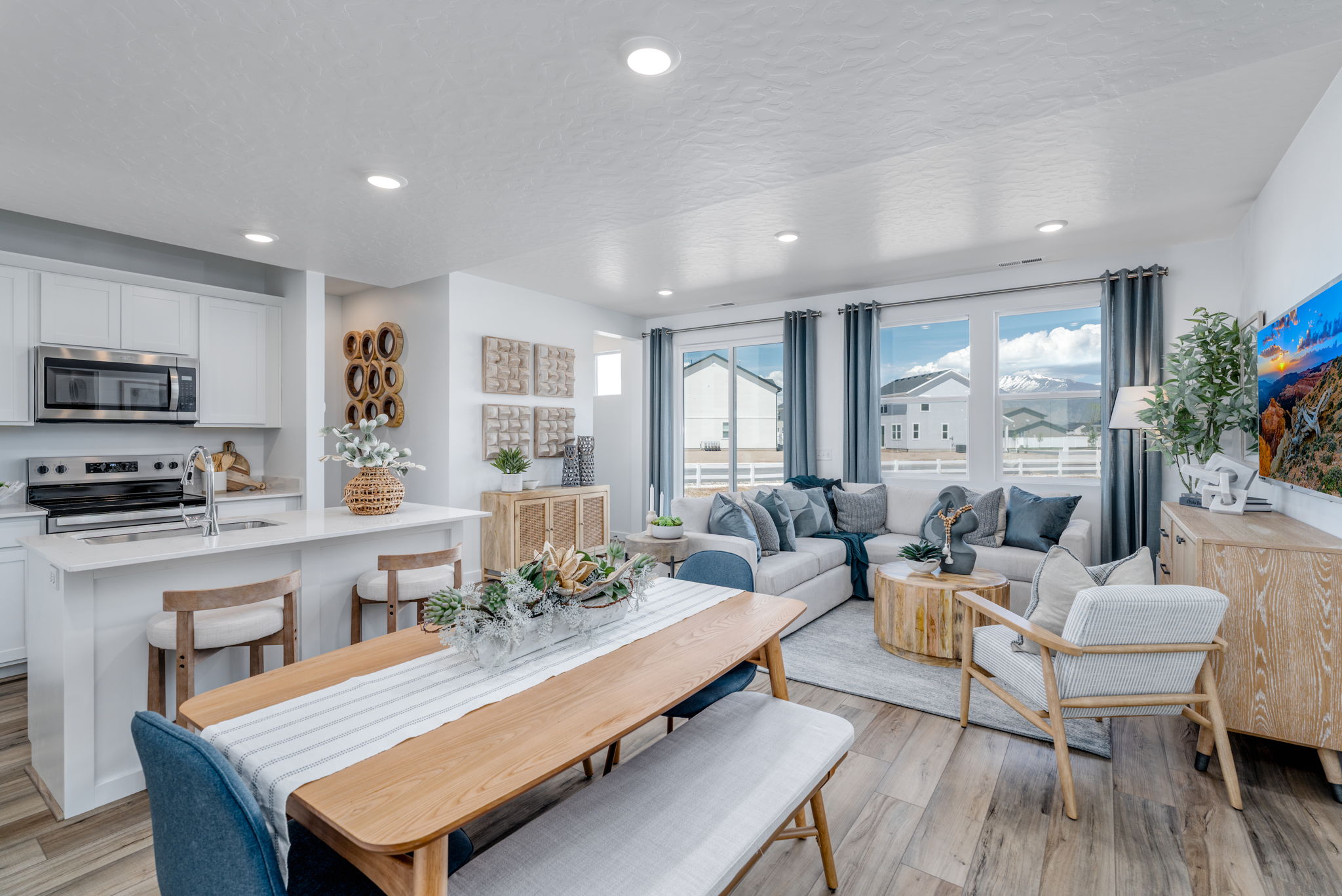 A large living room with a dining table and chairs.