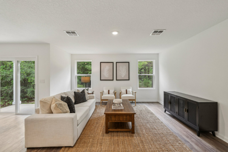 A living room with a tv and couches.