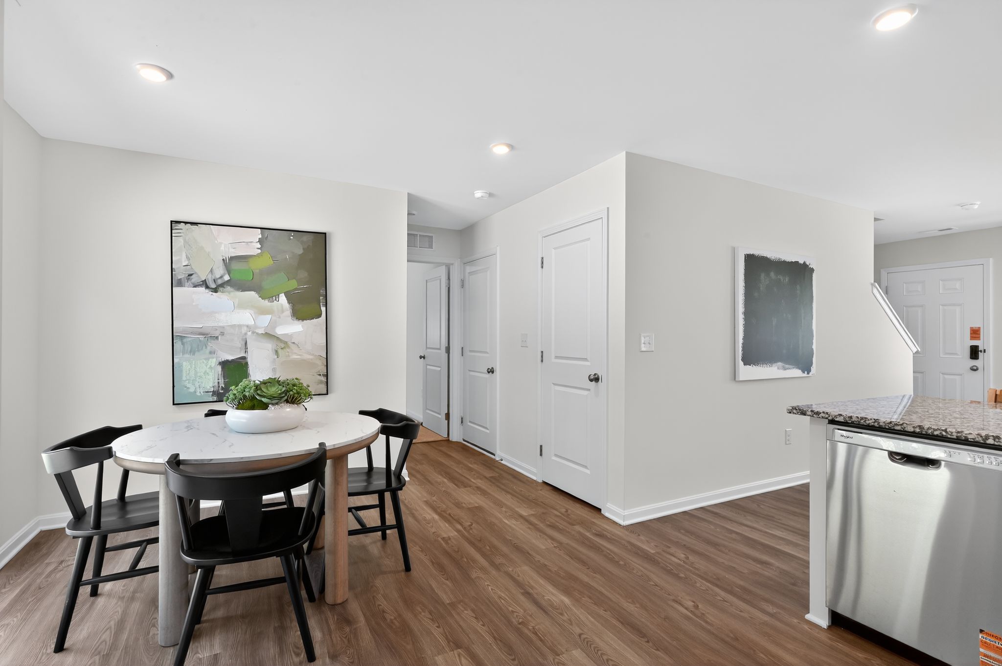 A room with a table and chairs.