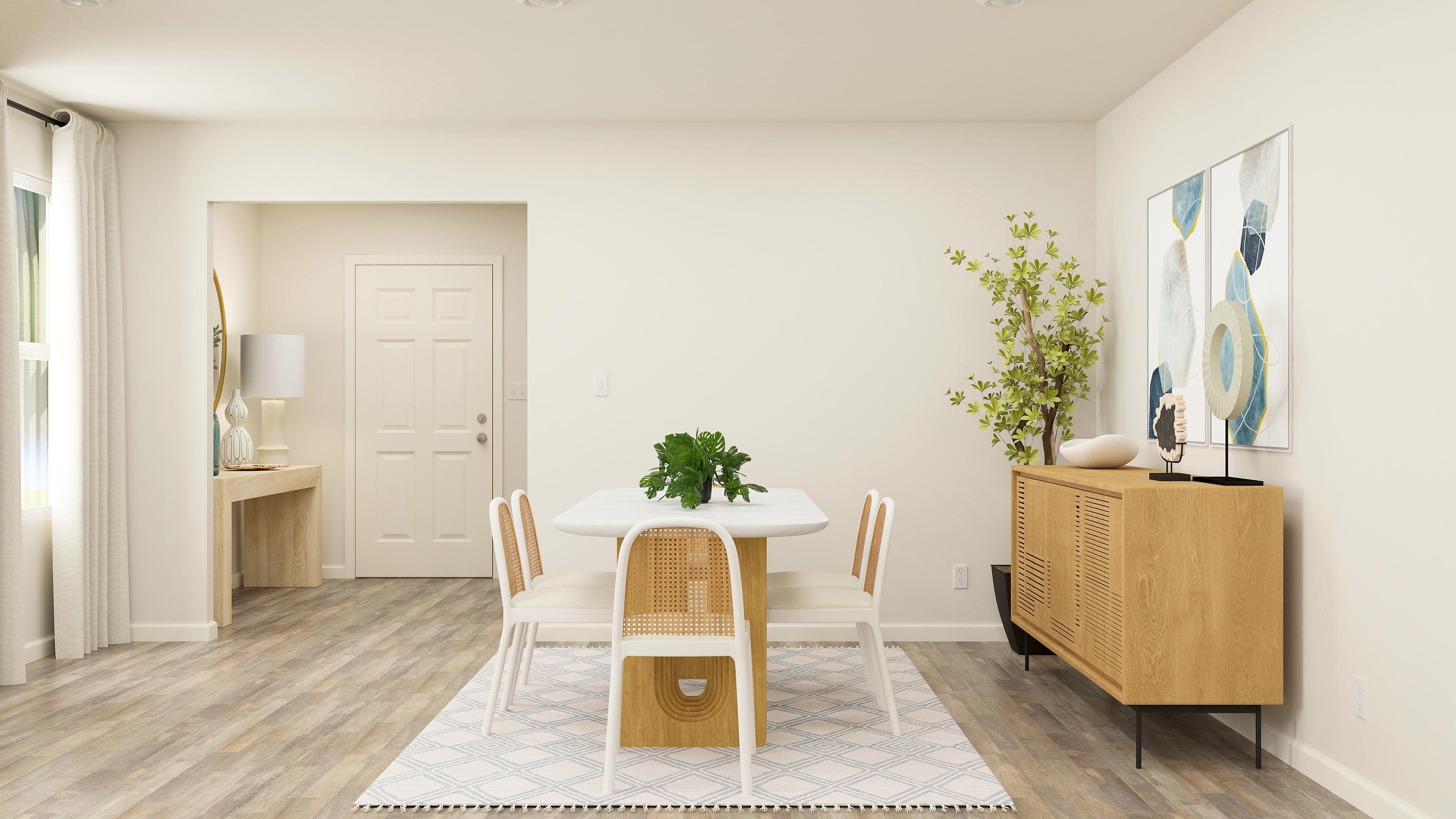 A room with a table and chairs.