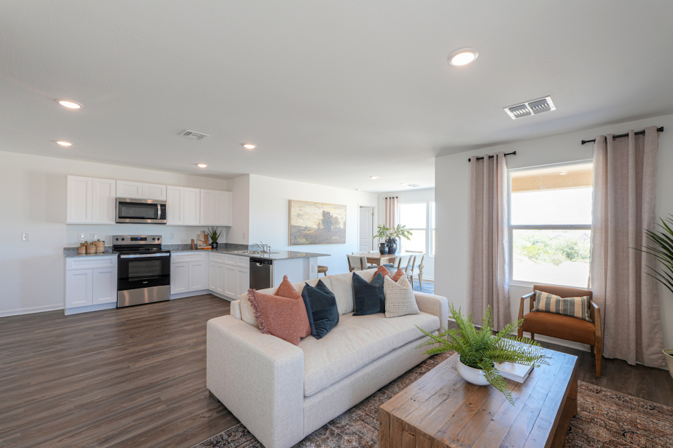 A living room with a couch and a table.