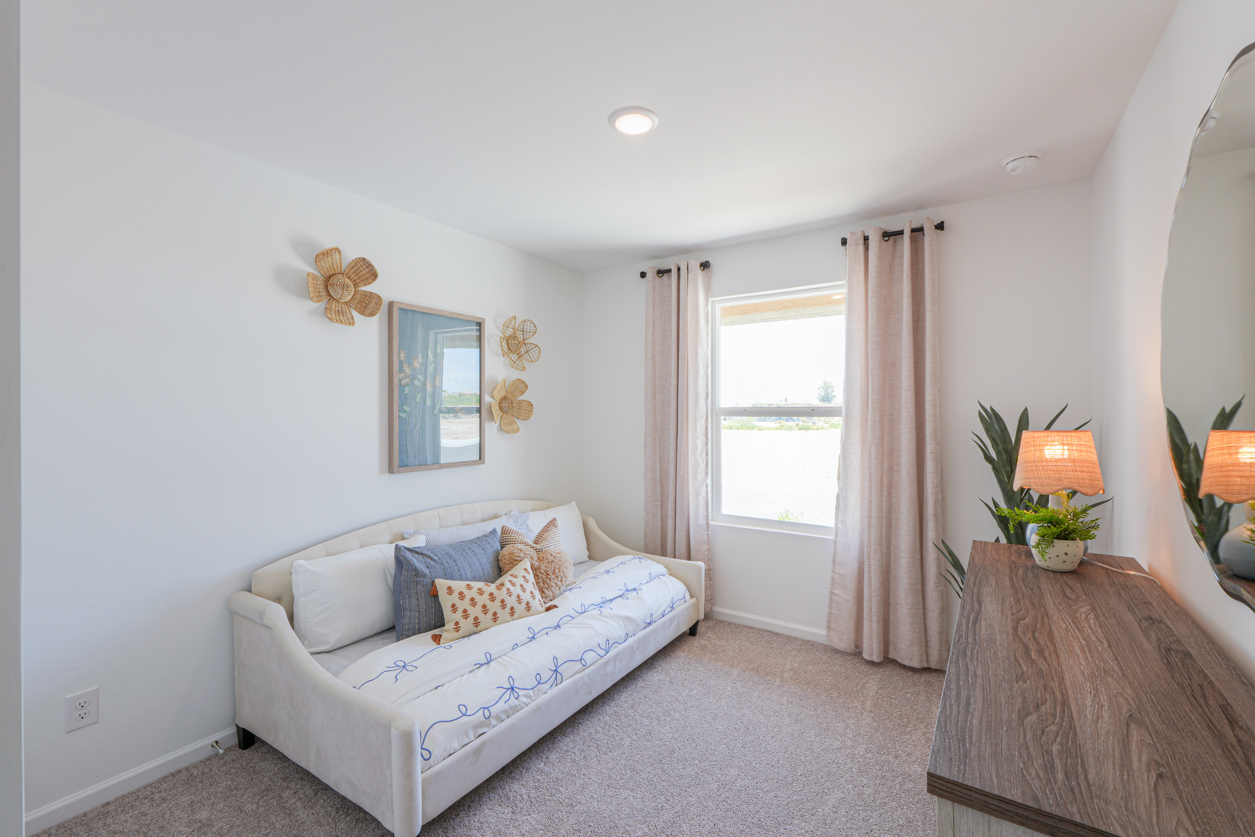 A living room with a white couch.