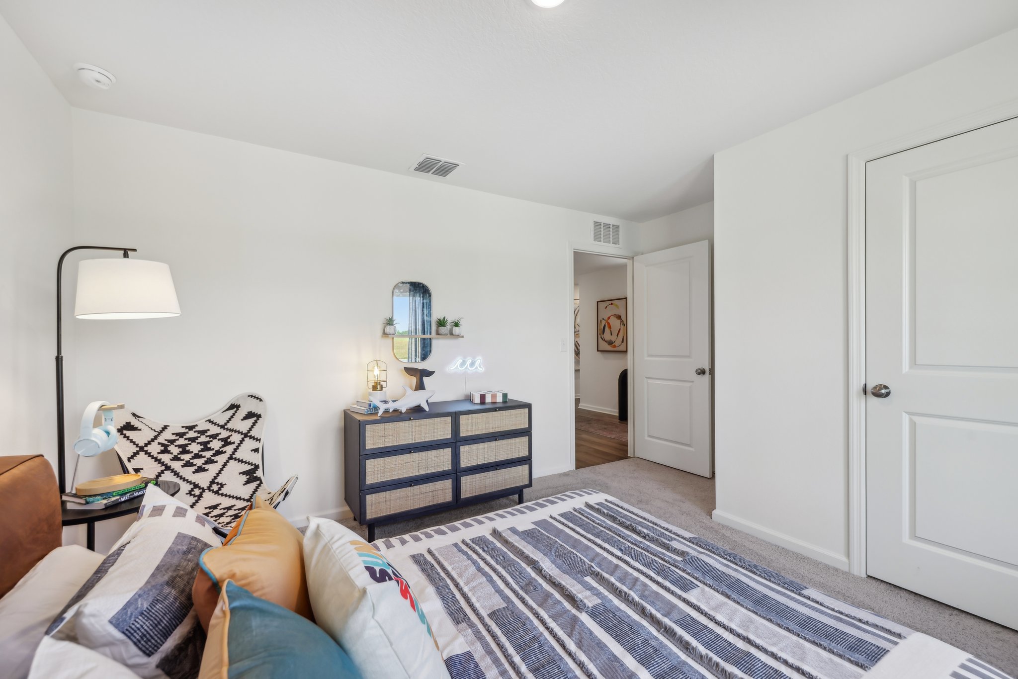 A living room with a rug and a couch.