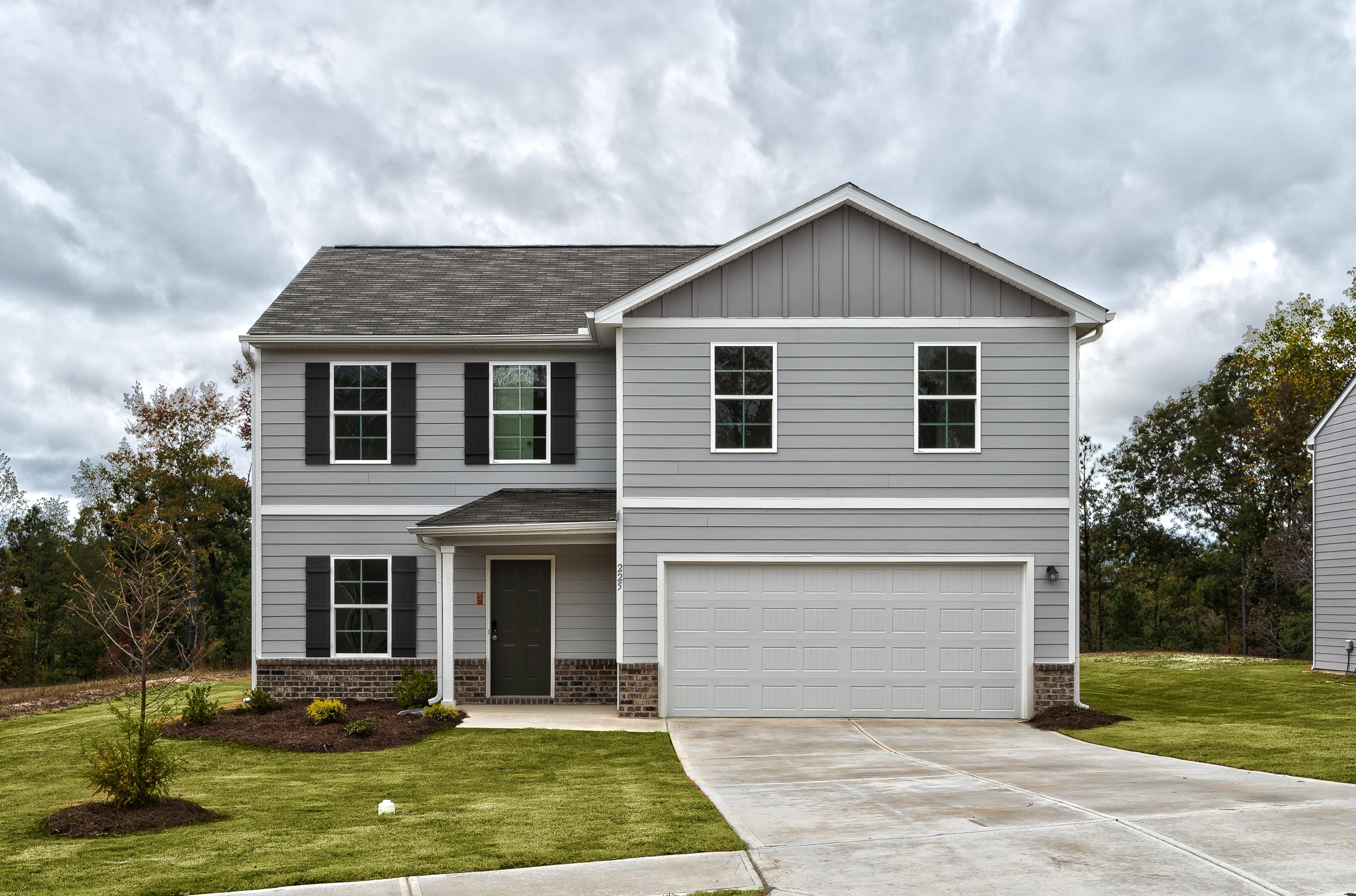 A white house with a garage.