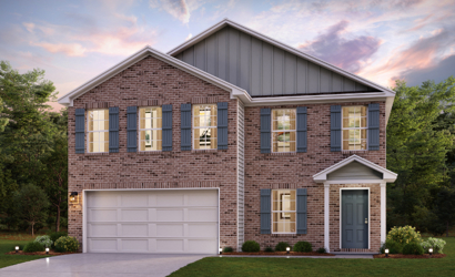 A brick house with a garage.