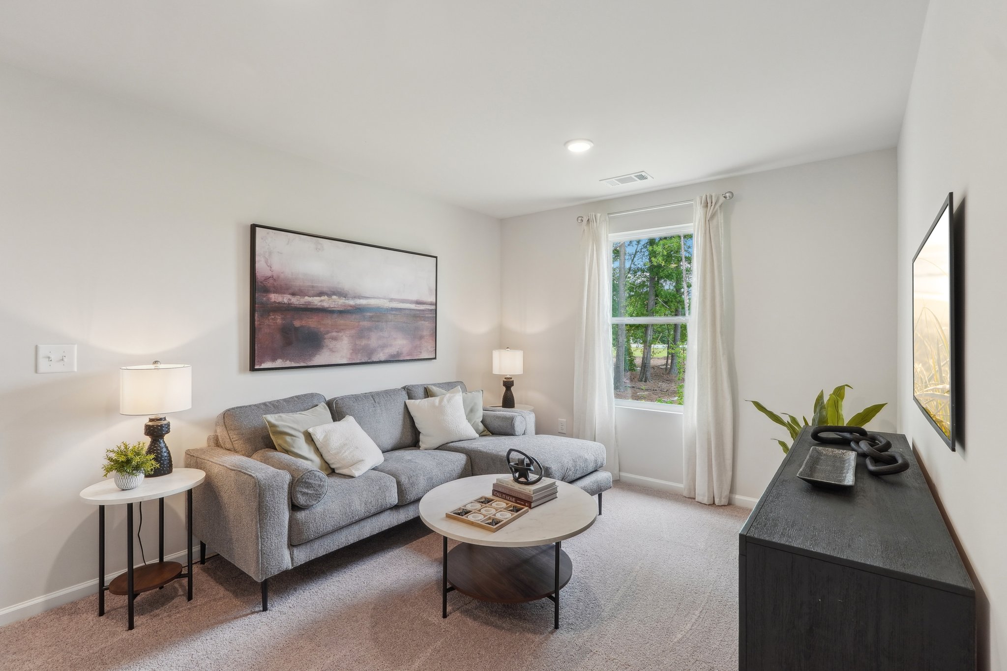 A living room with a couch and a coffee table.