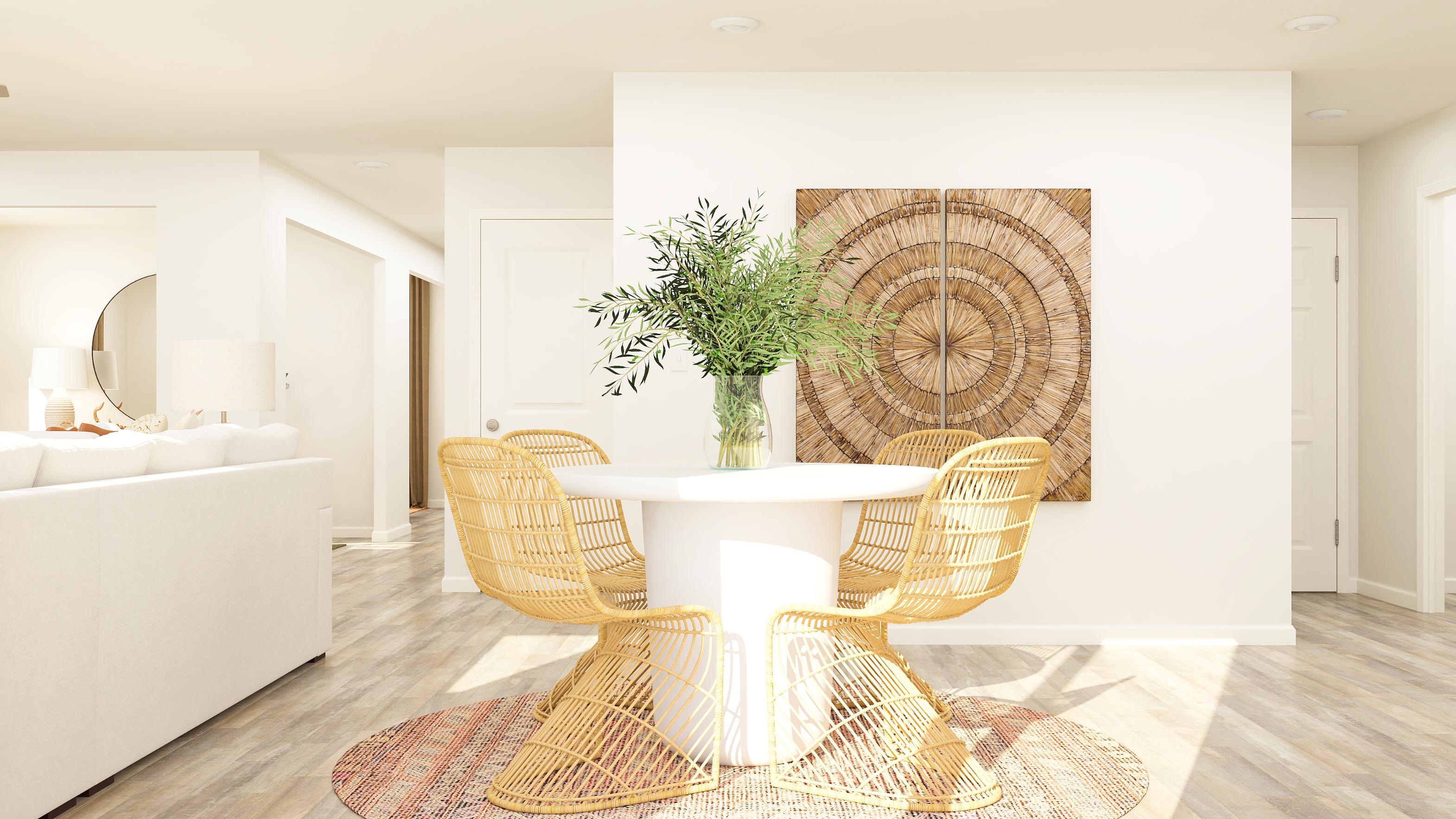 A room with a table and chairs.