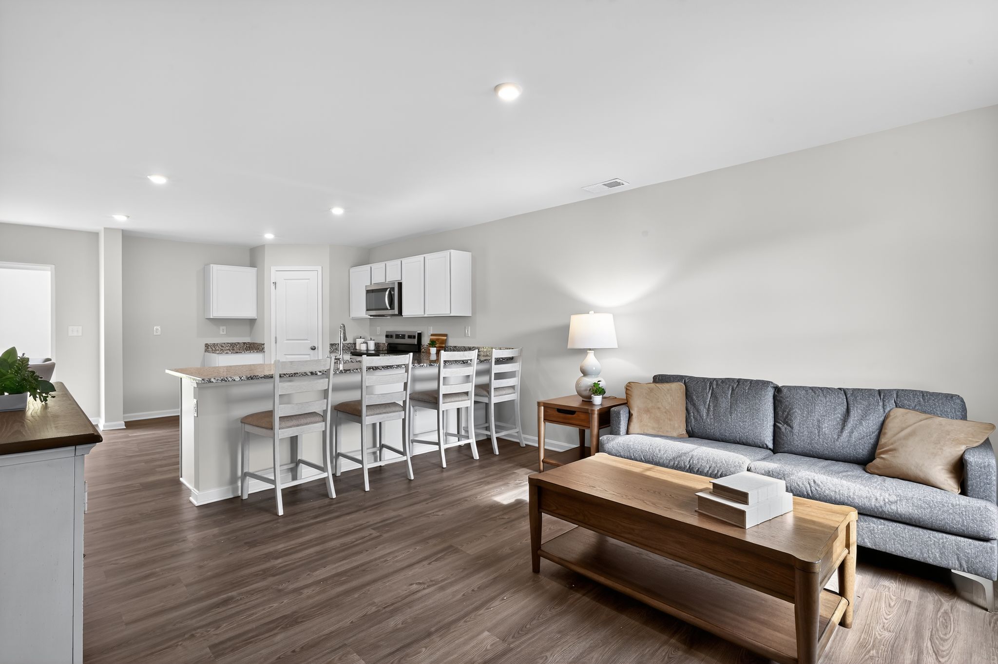 A living room with a couch and a table.