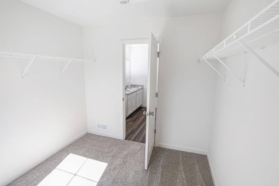 A hallway with a door.