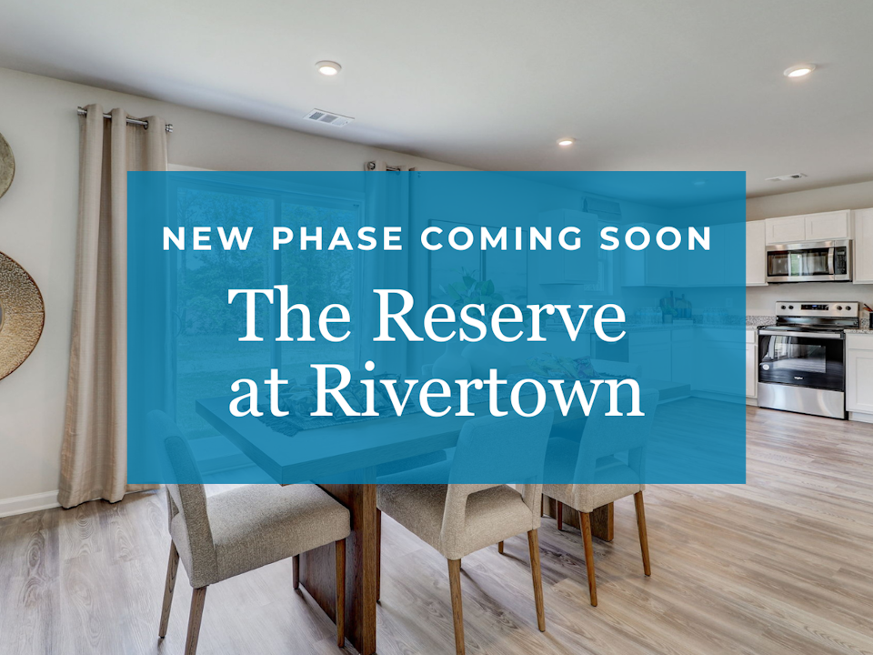 A room with a blue wall and chairs.