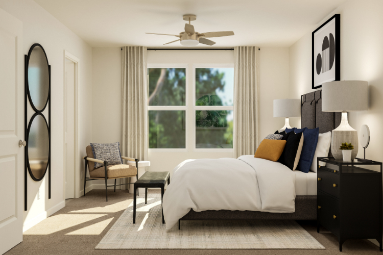 A bedroom with a bed and a fan.